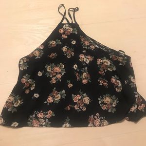 A flowery tank top,little side boob showing
